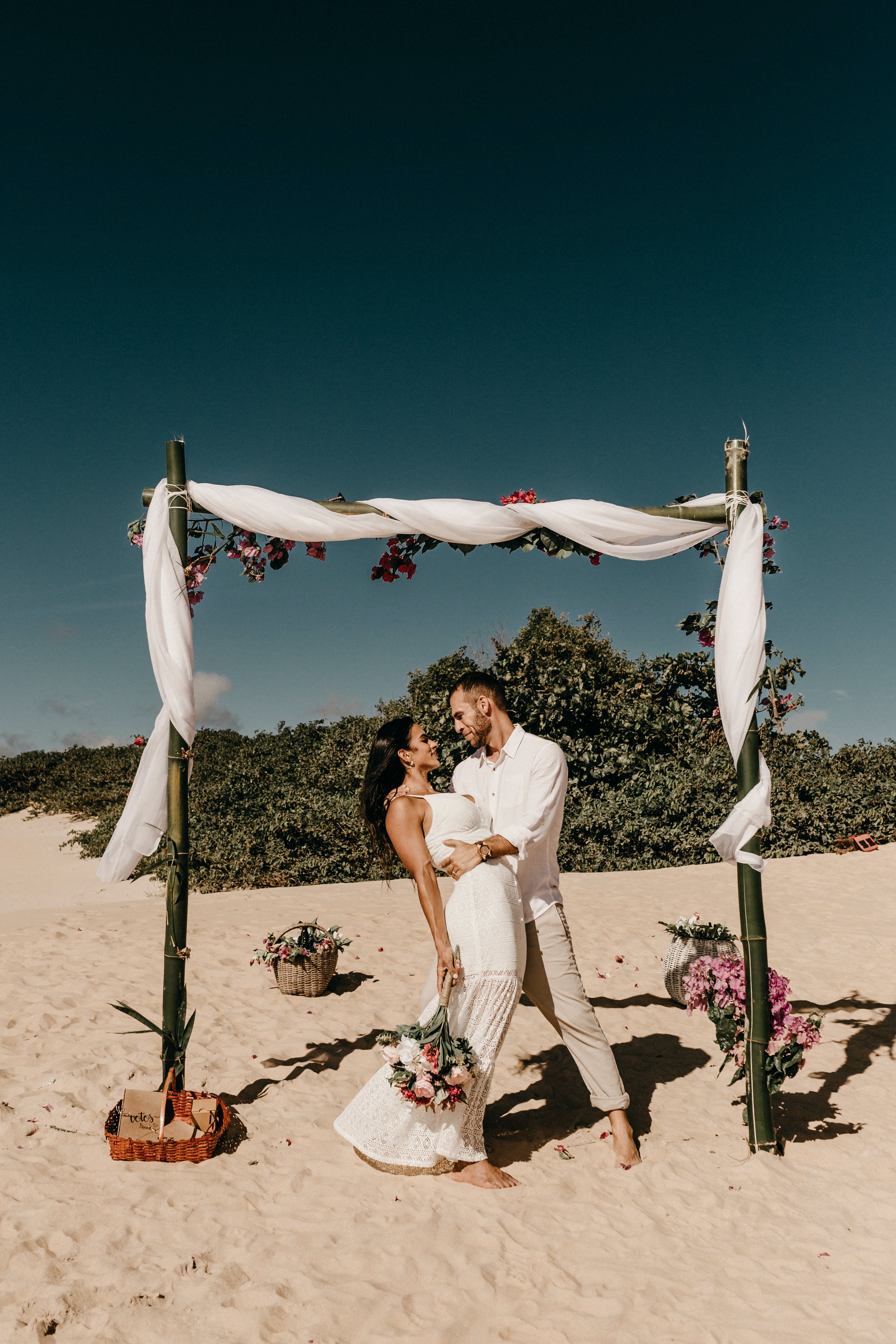 Free Bride and Groom on Sand Beach Stock Photo